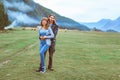 Guy with a girl on the background of mountains Royalty Free Stock Photo