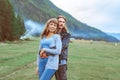 Guy with a girl on the background of mountains Royalty Free Stock Photo