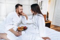 The guy and the girl bathrobe, girl feeds the guy fruit