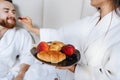 The guy and the girl bathrobe, girl feeds the guy fruit