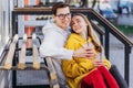 Couple drink coffee in transparent cups.