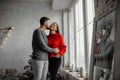 A guy with a girl is celebrating Christmas. A loving couple enjoy each other on New Year`s Eve Royalty Free Stock Photo