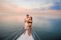 Guy with girl drink champagne on the ship. Royalty Free Stock Photo