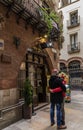 The guy and the girl are embracing standing near the entrance to the cafe 4 cats in Barcelona Royalty Free Stock Photo