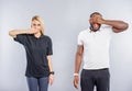 Guy and girl expressing their emotions by gestures Royalty Free Stock Photo