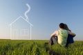 Guy and girl in the field and dreams about home Royalty Free Stock Photo
