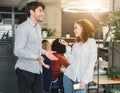 Guy and girl having conversation during working time in office Royalty Free Stock Photo