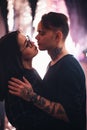 Guy and the girl kiss closeup on a light background