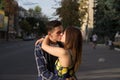 the guy and the girl are kissing on the background of the road, the city Royalty Free Stock Photo