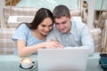 Guy and girl looking at laptop Royalty Free Stock Photo