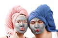 A guy with a girl looks at the camera and send an air kiss, mask for skin man and woman, guy with a girl make a mask for the skin Royalty Free Stock Photo