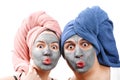 A guy with a girl looks at the camera and send an air kiss, mask for skin man and woman, guy with a girl make a mask for the skin Royalty Free Stock Photo