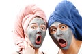 A guy with a girl looks at the camera in surprise, mask for skin man and woman, guy with a girl make a mask for the skin together Royalty Free Stock Photo