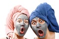 A guy with a girl looks at the camera in surprise, mask for skin man and woman, guy with a girl make a mask for the skin together Royalty Free Stock Photo