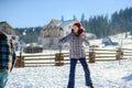 Guy and girl play snowballs.