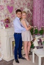 A guy and a girl are posing in a pink room Royalty Free Stock Photo