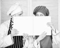 Guy and girl read book recipes. Culinary concept. Family learn recipe. Improve cooking skill. Book family recipes Royalty Free Stock Photo