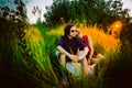 Guy and the girl sitting on a background of grass Royalty Free Stock Photo