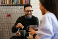 A guy and a girl are sitting together in a cafe. They drink tea.Happy couple date concept Royalty Free Stock Photo