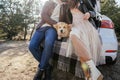 The guy with the girl spend time with the Corgi