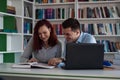 Guy and girl studying in the library Royalty Free Stock Photo