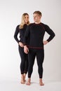 Guy and girl in thermal underwear on a white background Royalty Free Stock Photo