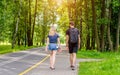 A guy and a girl walk along the path