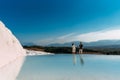 A couple in love walks along the shore of a mountain lake Royalty Free Stock Photo