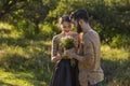 guy gives flowers to his girlfriend Royalty Free Stock Photo