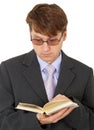 Guy with glasses reading scientific book Royalty Free Stock Photo
