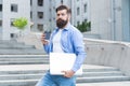 Guy going to work urban background. Man with laptop walking empty street. Business center reopening. Modern life
