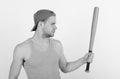 Guy in grey tank top holds bright green bat. Player with serious face plays baseball. Sports and baseball training Royalty Free Stock Photo