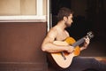 Guy, guitar or play of music to relax, thinking or planning of creative, vision or idea as dream sound. Man, performance Royalty Free Stock Photo