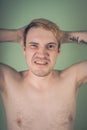 The guy with the naked torso on a green background Royalty Free Stock Photo