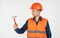 Guy with hammer professional master repair wear helmet uniform, tools shop concept