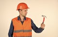 Guy with hammer professional master repair wear helmet uniform, tools shop concept