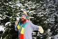 Guy with happy face with firtrees covered with snow Royalty Free Stock Photo