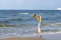 A little guy on the sandy beach.