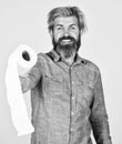 Guy having fun with toilet paper. Softness strength and absorbency. Prevent Toilet Paper Hoarding. Man hold toilet paper