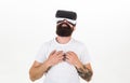 Guy with head mounted display enjoy virtual reality. Virtual cinema concept. Man with beard in VR glasses enjoy watching