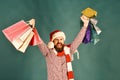 Guy or hipster shopper in red hat with shopping bags Royalty Free Stock Photo