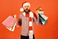 Guy or hipster shopper in red hat with shopping bags Royalty Free Stock Photo