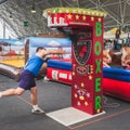 Guy hitting punchball at Rocking the Park event in Royalty Free Stock Photo