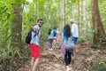 Guy Hold Hand Welcome People Group With Backpacks Trekking On Forest Path Back Rear View, Young Men And Woman On Hike Royalty Free Stock Photo