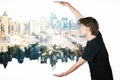 Guy holding abstract city