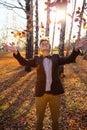 Guy holding bouquet of autumn leaves