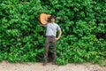 The guy is holding the guitar, outdoo, cargo pants Royalty Free Stock Photo