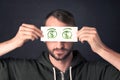 Guy holding a paper with hand drawn dollar sign Royalty Free Stock Photo