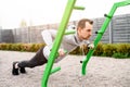 A guy is doing outdoors bar body weight workout Royalty Free Stock Photo