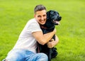 Guy hugging with his dog labrador playing in the park Royalty Free Stock Photo